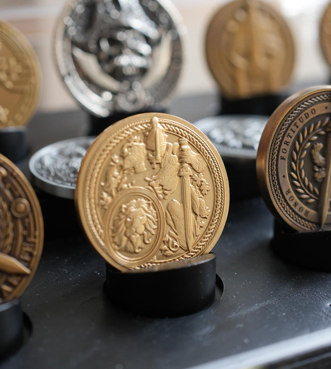 Decorative coins on stands with a blurred background