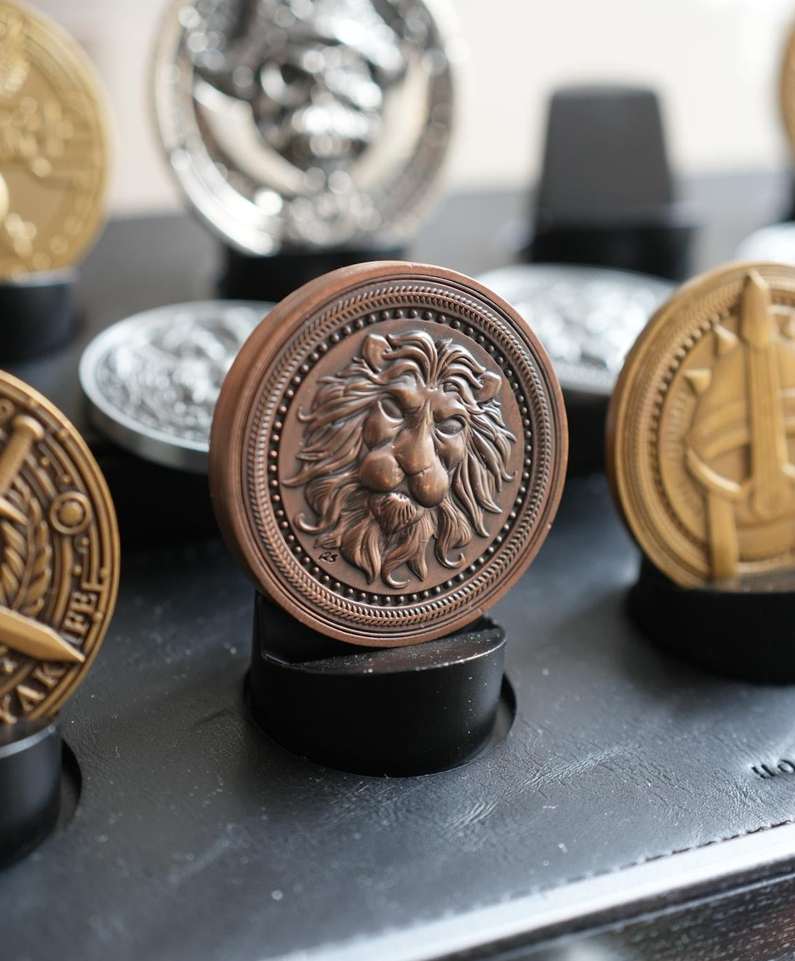 Collection of decorative metal knobs on a metallic surface